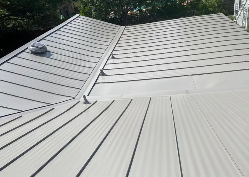 Solar attic fan installed on a metal roof for Roof Ventilation in Mililani Town